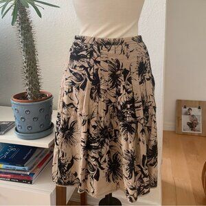 Ann Taylor A-line tan with black florals pleaded skirt; 100% cotton; size 8
